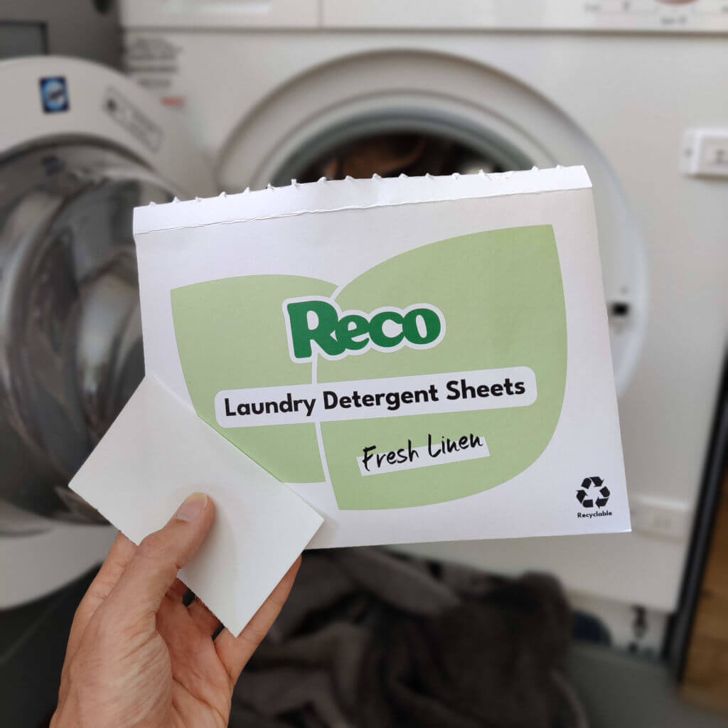 Reco Laundry Detergent Sheets In front of washing machine